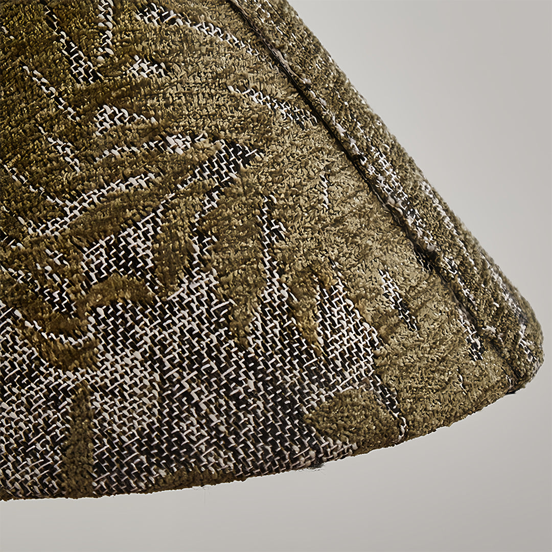 Close-up detail of retro pendant lighting showing intricate perforated metalwork pattern and conical shade structure