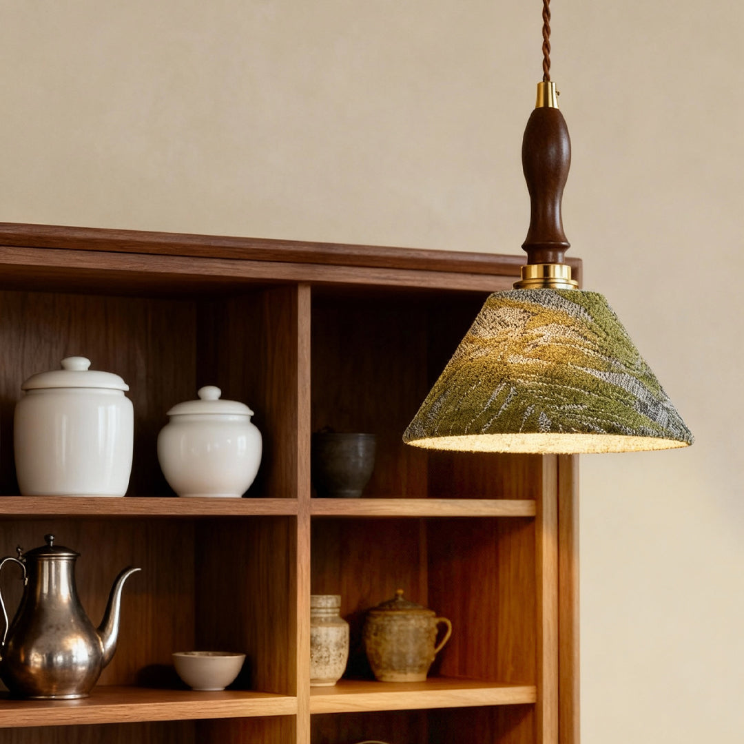 Retro pendant lighting suspended above open shelving displaying pottery in contemporary kitchen with warm wood tones