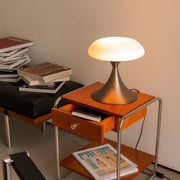 Retro style table lamps on a wooden desk, enhancing the workspace with a blend of modern and vintage aesthetics.