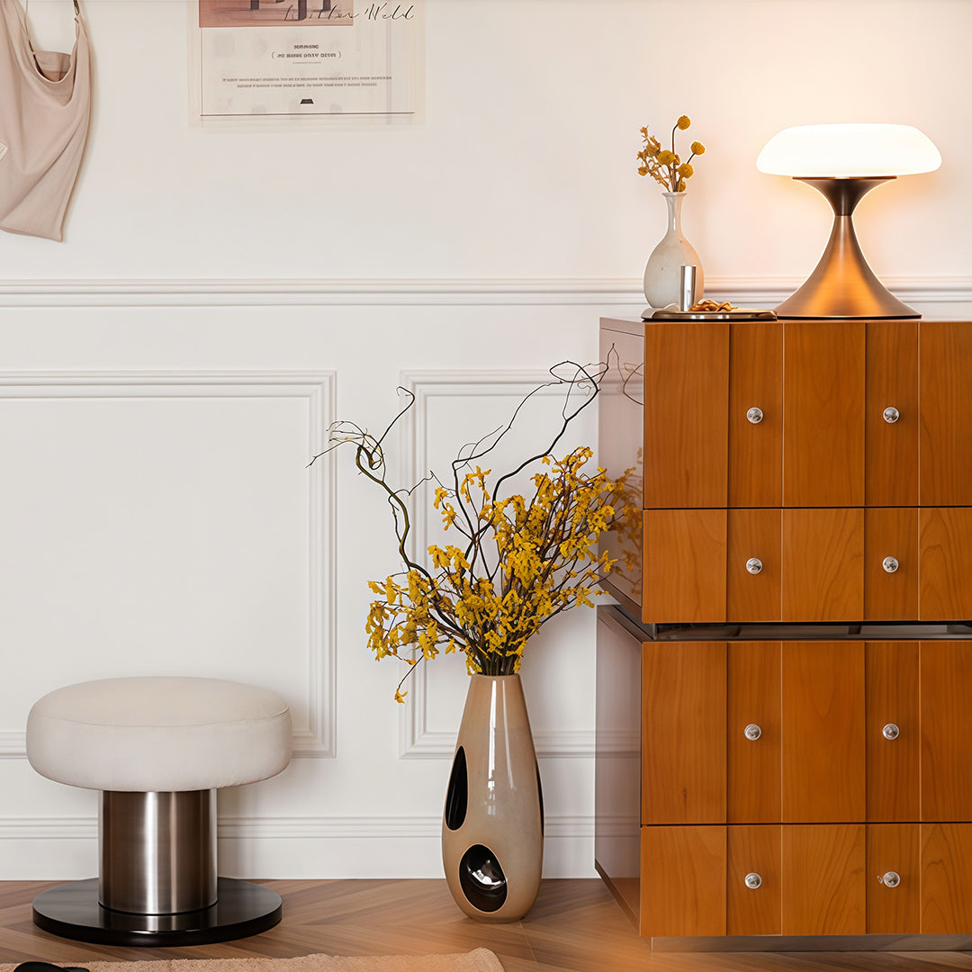 Retro style table lamps on a wooden side table, providing warm illumination in a stylish interior setting.