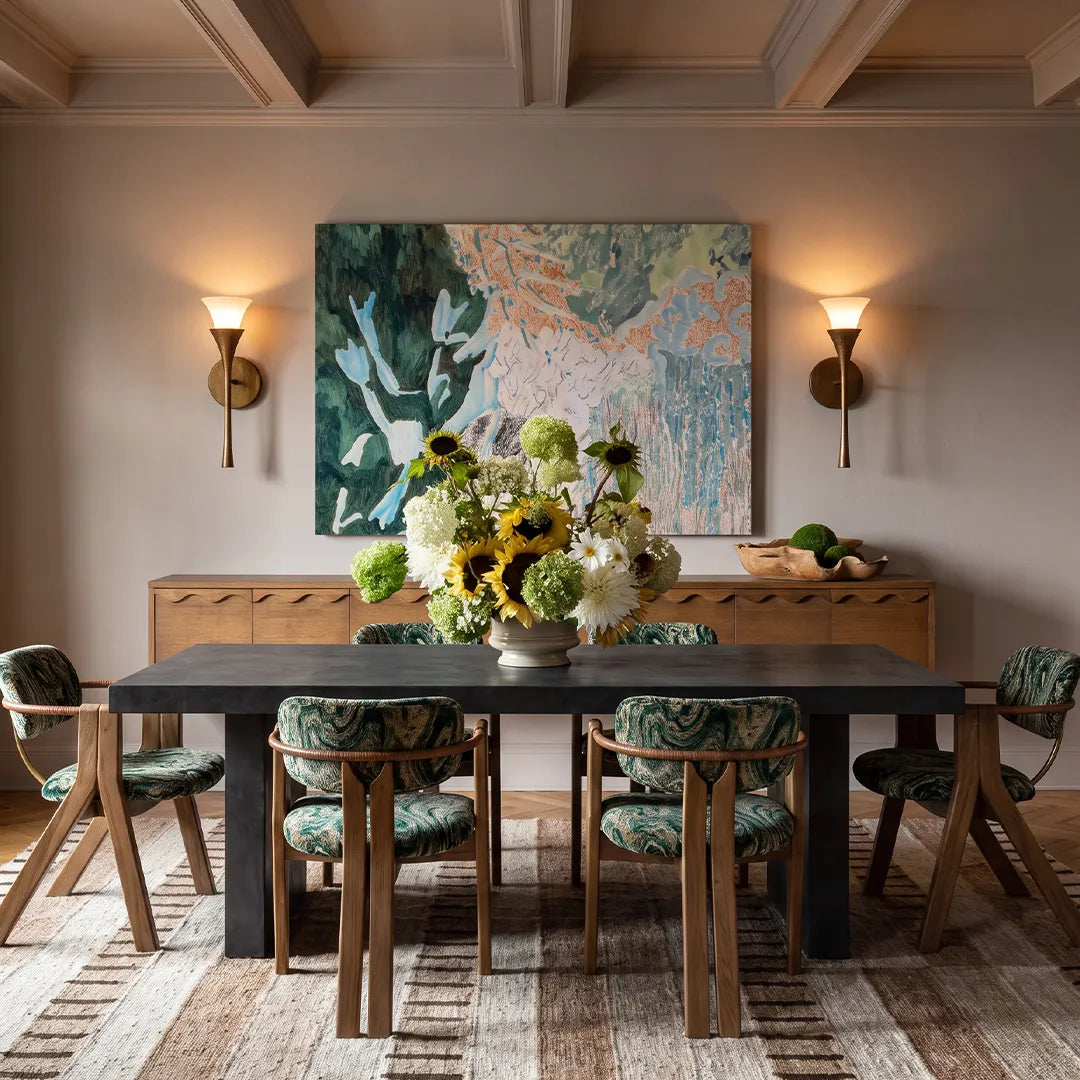 Retro wall sconce lighting a dining room with a warm glow and classic vintage-inspired style.