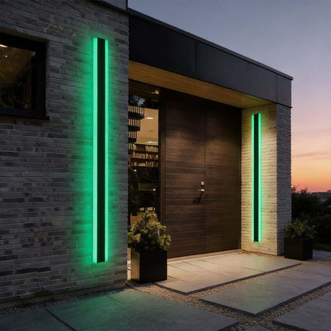 RGB wall light illuminating a modern house entrance with vibrant vertical color glow.