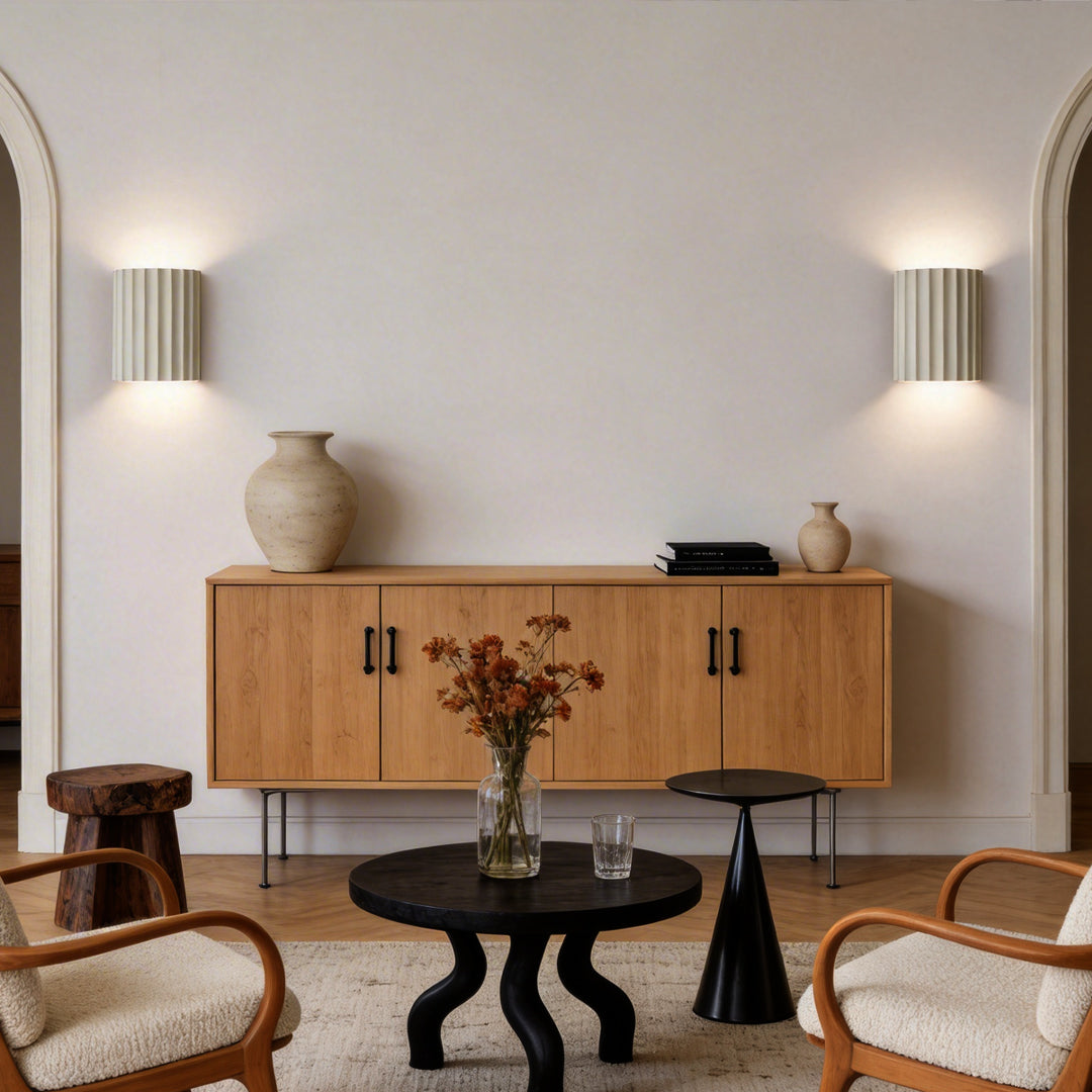 Ribbed wall sconces enhancing a modern living room with elegant ambient light.