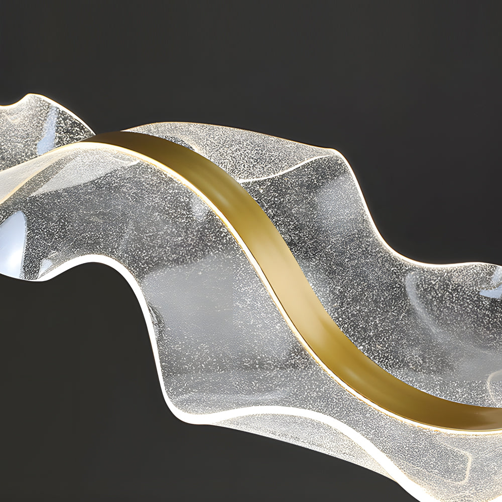 Ribbon pendant light with a wave design, providing elegant illumination in a contemporary space.
