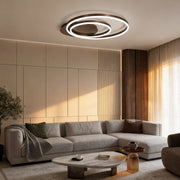 Ring pendant light fixture illuminating a modern living room with warm, ambient glow.