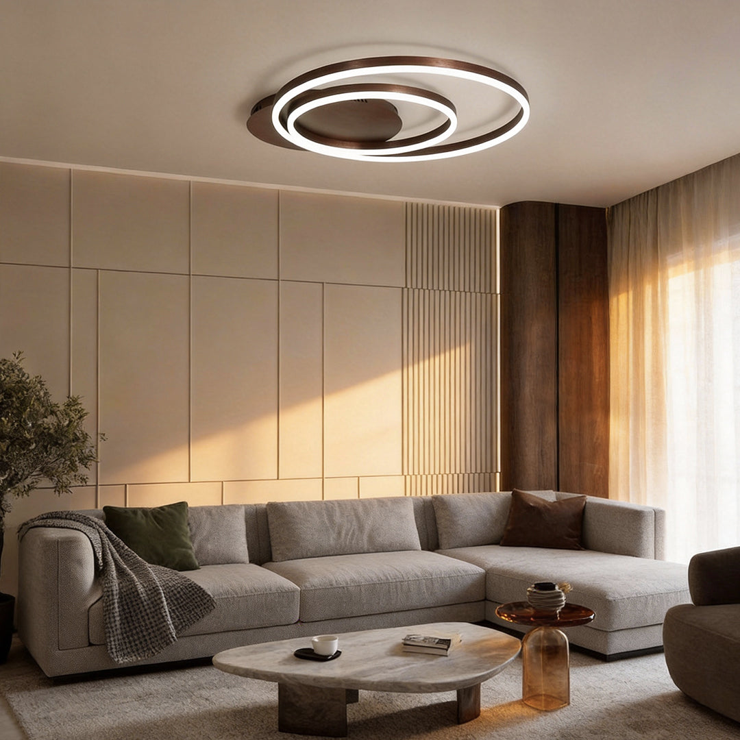 Ring pendant light fixture illuminating a modern living room with warm, ambient glow.