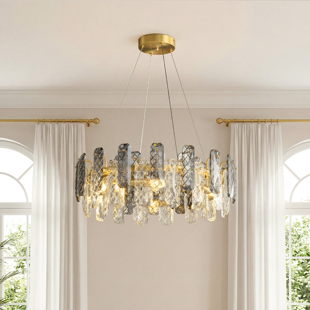 Stunning ring-shaped contemporary crystal chandeliers featuring a gold frame with alternating clear and smoky textured crystal pendants in an elegant room.