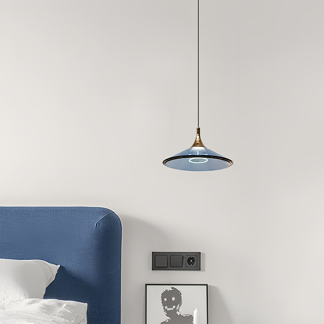 Rise and fall pendant lights with blue vintage-style shade hanging in contemporary bedroom interior