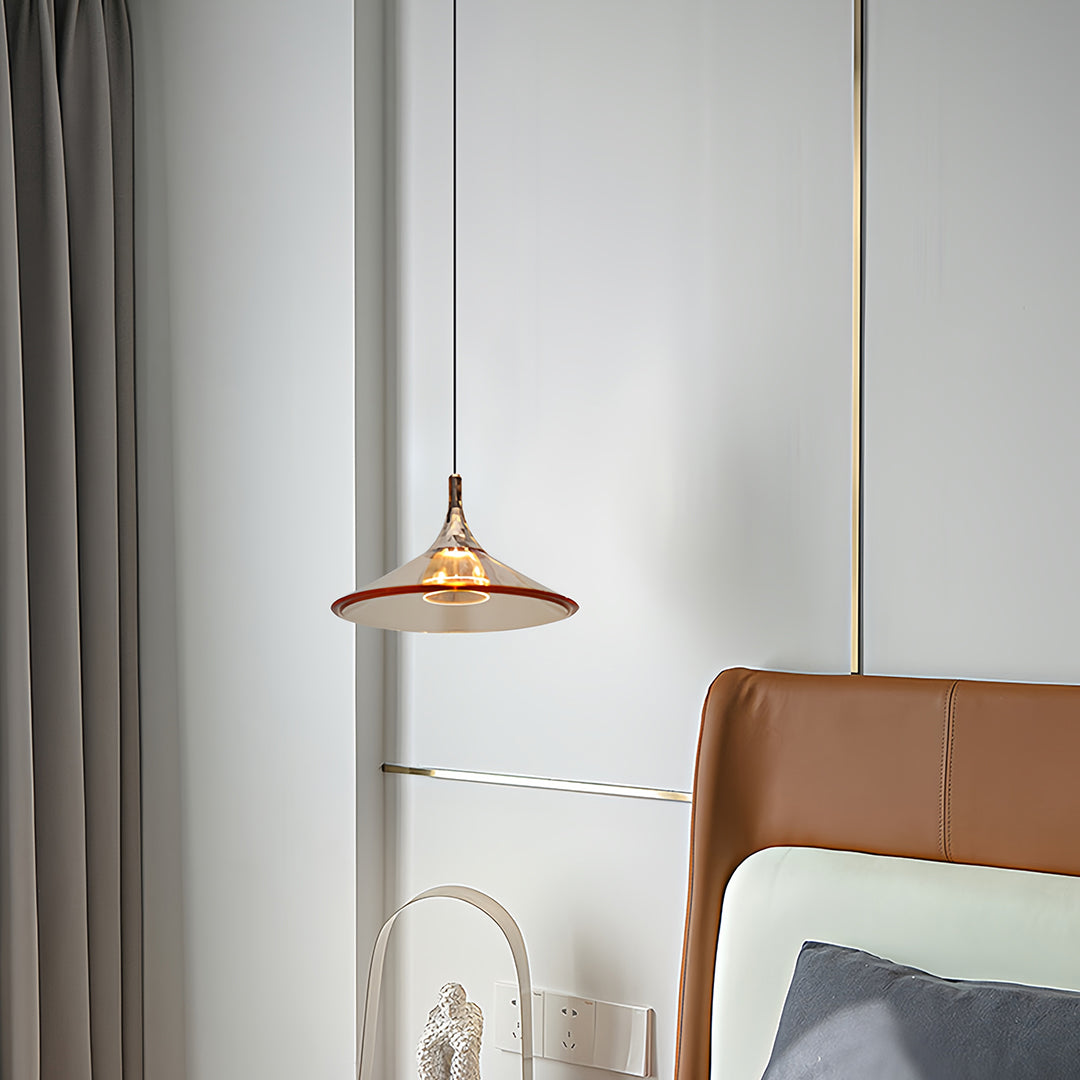 Rise and fall pendant lights with copper shade creating warm accent in neutral bedroom with textiles