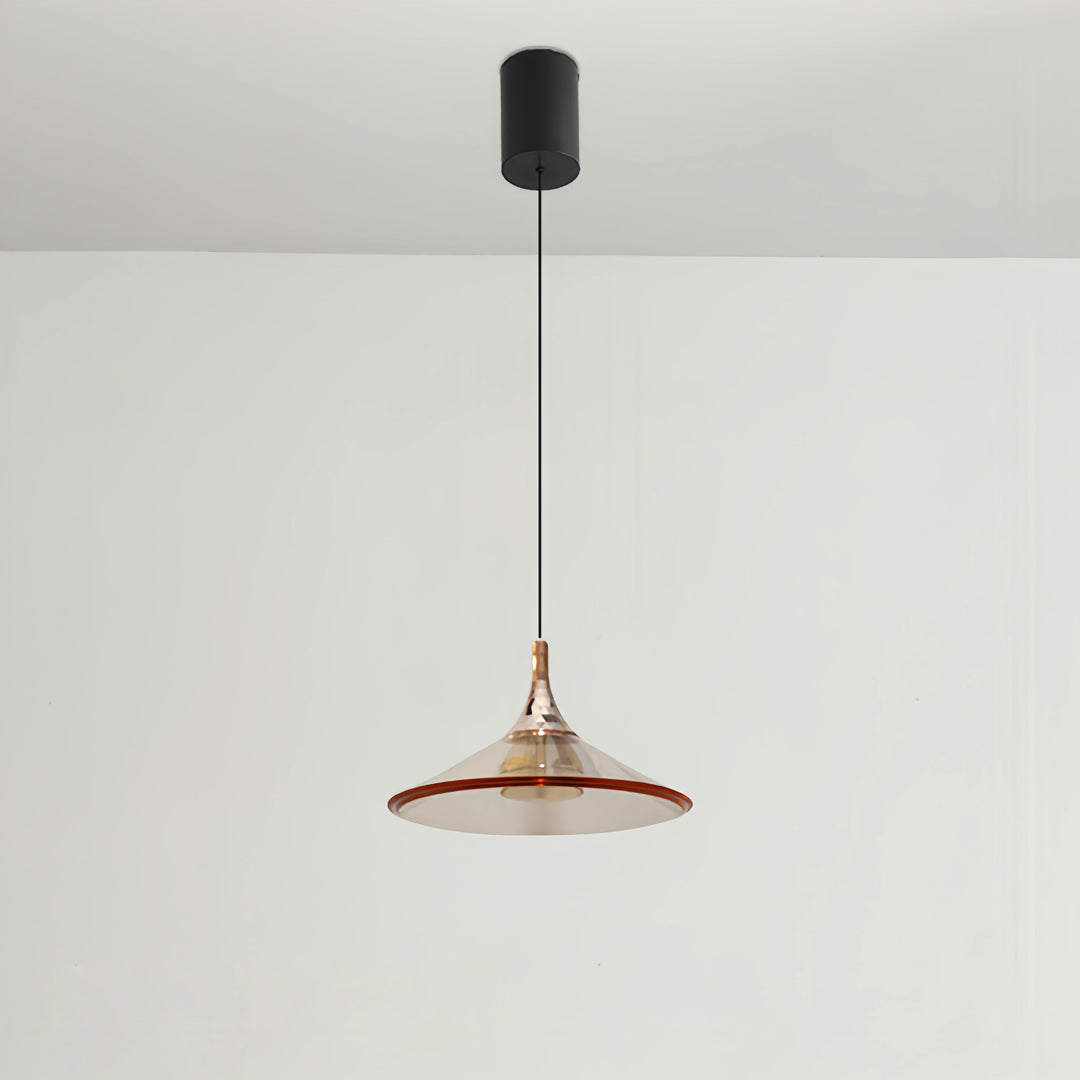 Rise and fall pendant lights featuring copper-tone shade against clean white wall backdrop