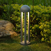 Contemporary bollard lights with dual illumination creating ambient lighting in rock garden