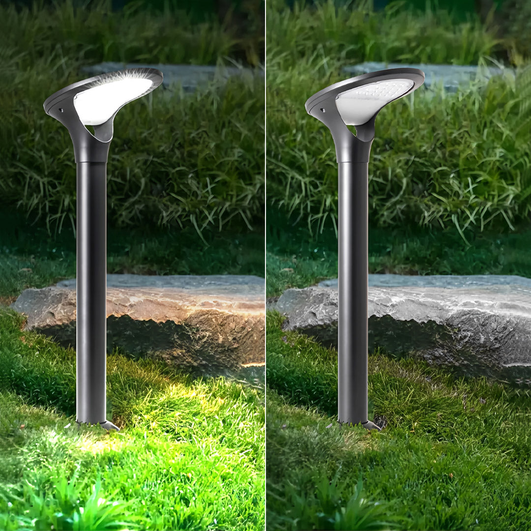 Set of solar bollard lights mounted along a rocky garden path, showcasing bright cool white and warm light illumination.