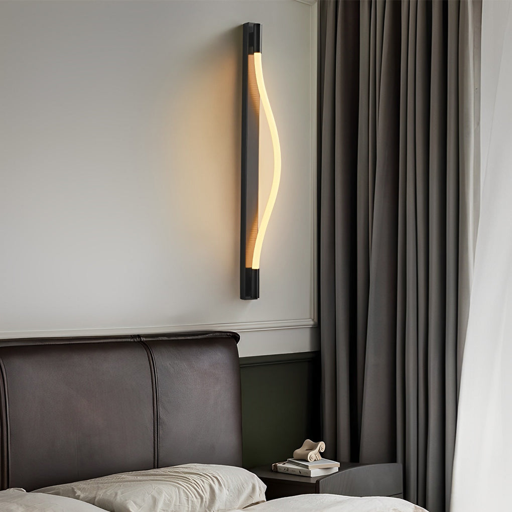 Rope wall sconce light with a black finish, providing ambient light near a bed.