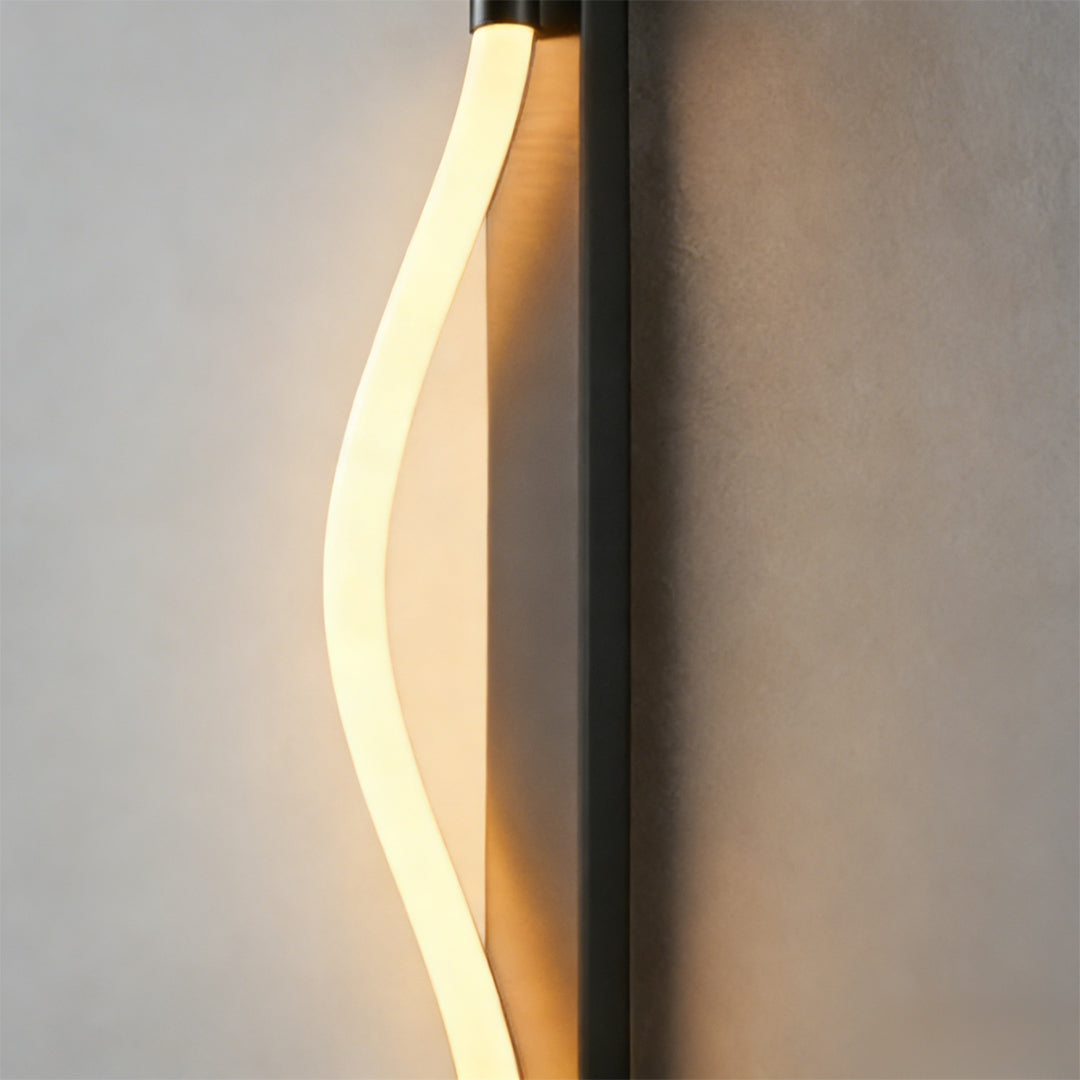 Rope wall sconce light with a close-up of its curved structure and light.