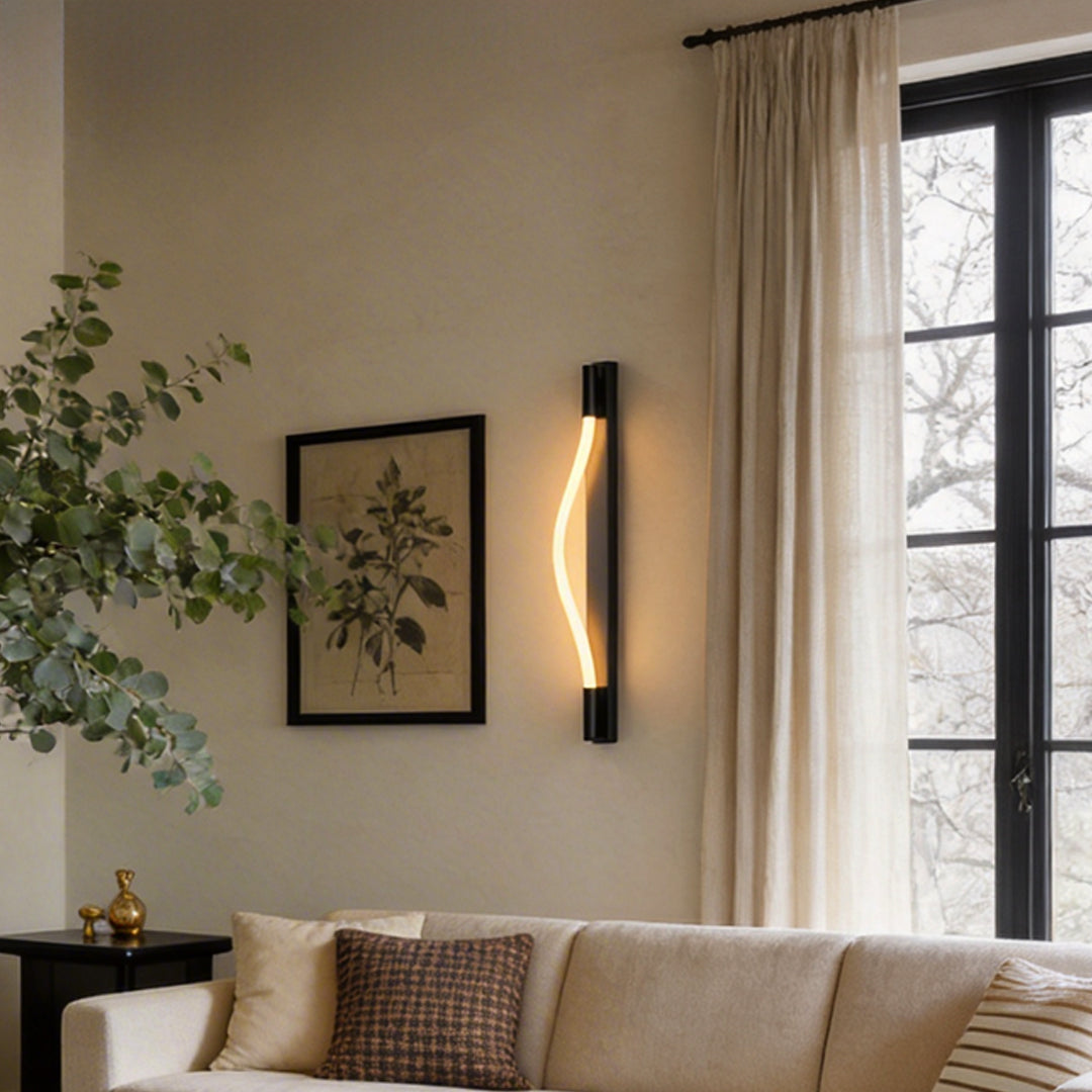 Rope wall sconce light with a curved design, providing warm illumination in a modern living room.