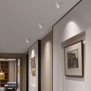 Round anti-glare adjustable LED downlight installed in a hallway, providing soft and focused lighting for modern homes.