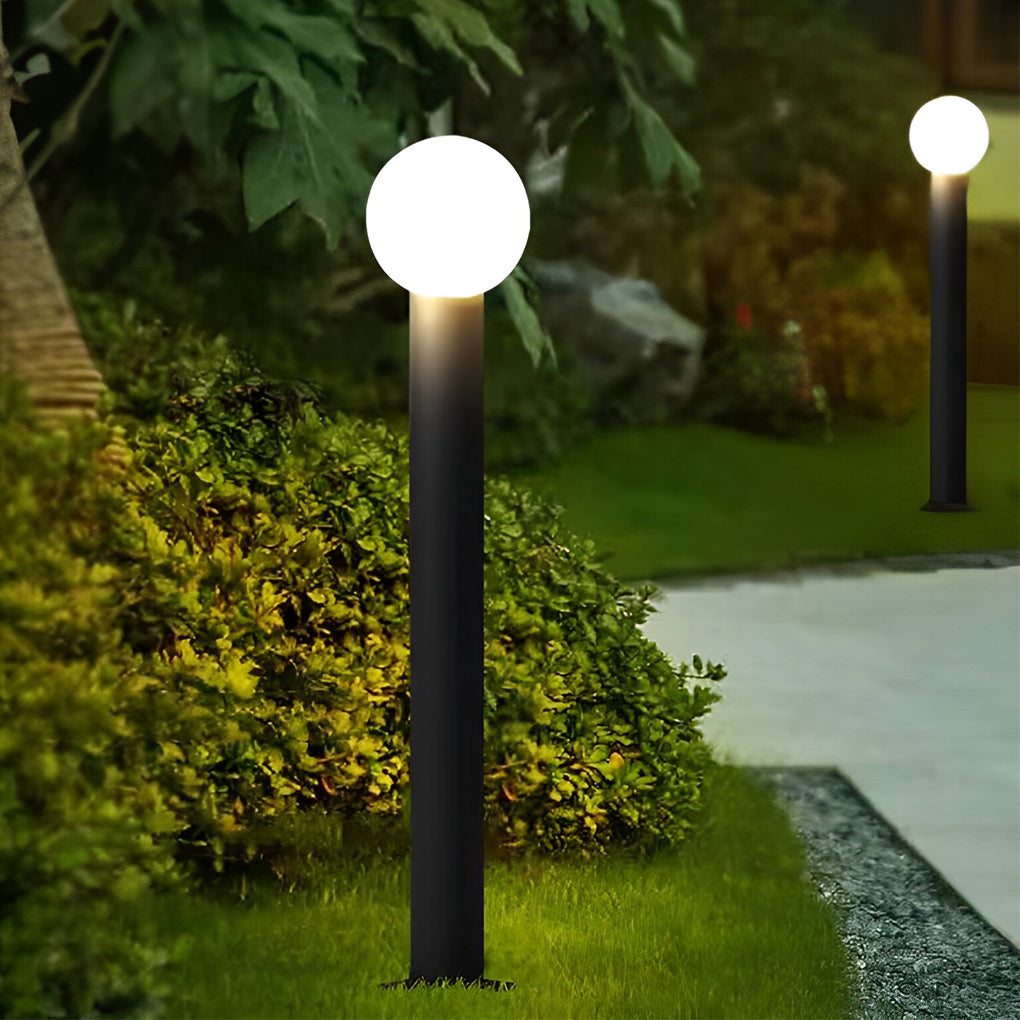 Round bollard lights with a close-up of their glowing spherical head.