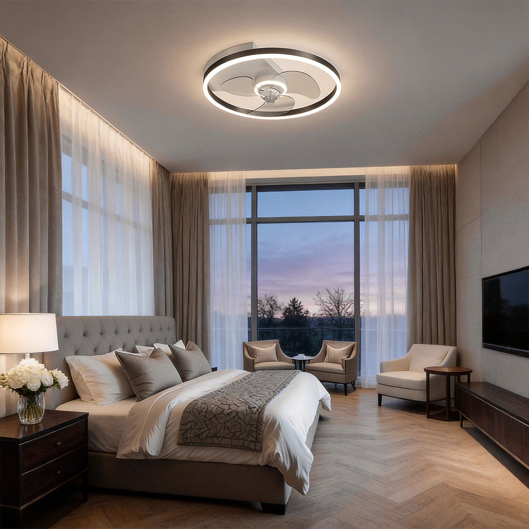 Round ceiling fan with light illuminating a modern bedroom with large windows and neutral decor.