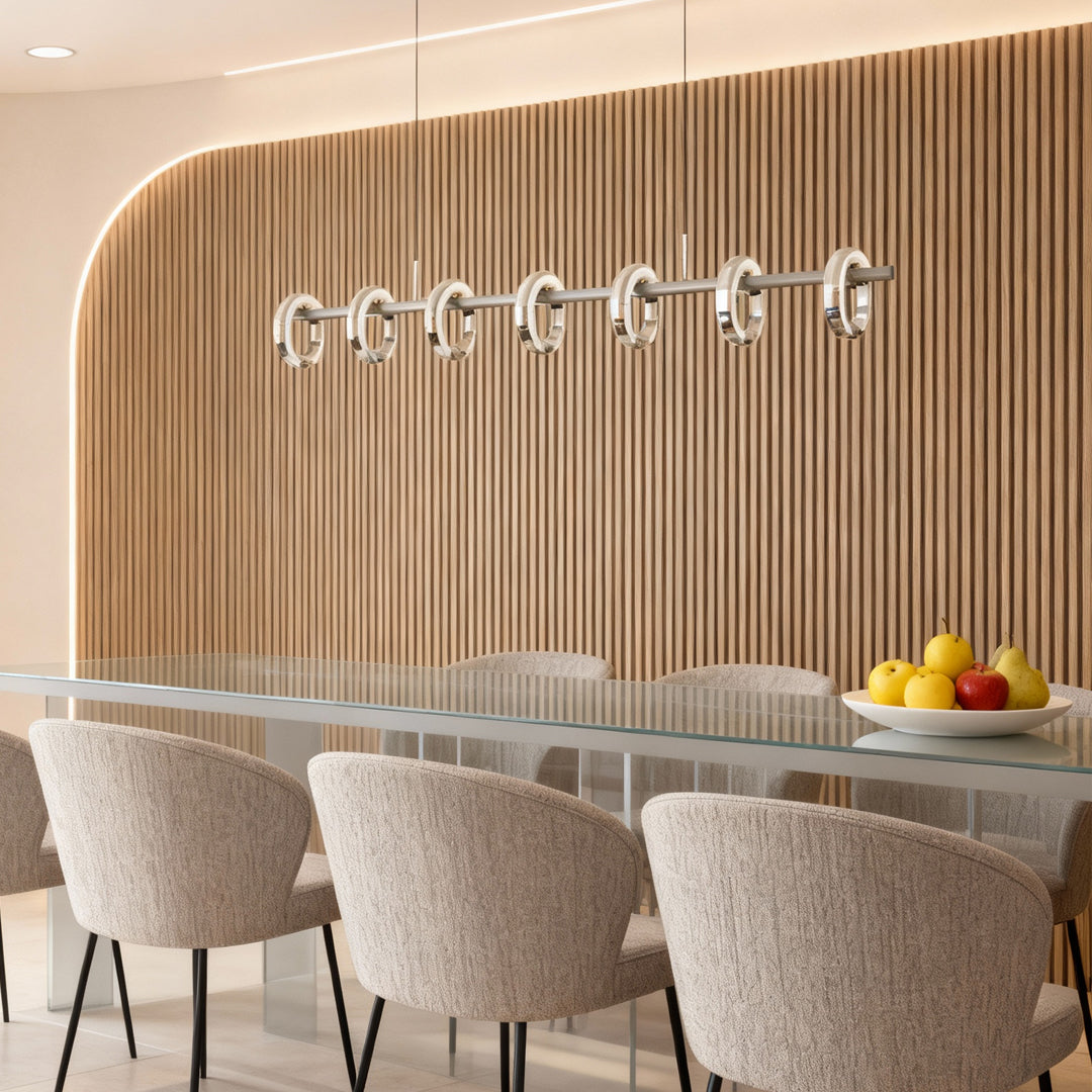 Elegant dining room lit by a modern round chandelier with multiple suspended circular ring fixtures.