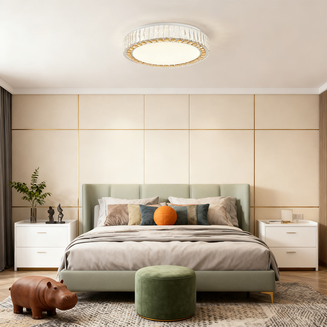 Round crystal ceiling light bringing soft illumination to a stylish bedroom interior.