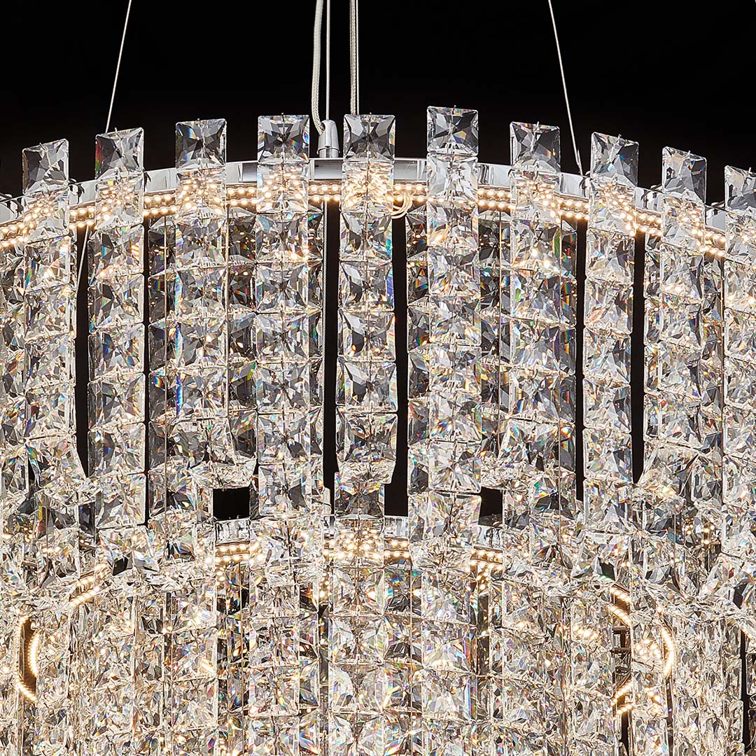 Round crystal chandelier modern with gold frame and layered sparkling prisms.