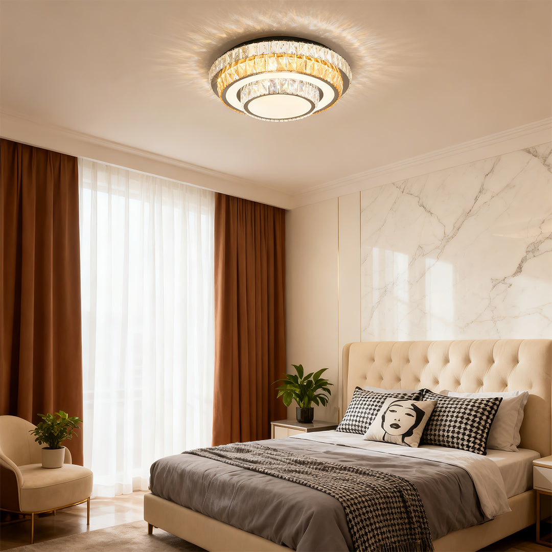 Round crystal-edged modern flush mount light fixture in a luxury bedroom space.