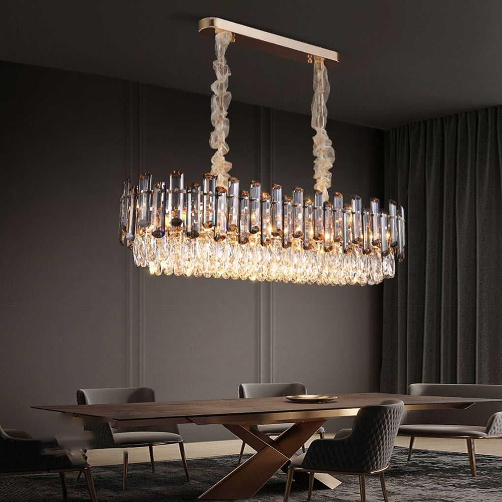 Round drum crystal chandelier illuminating a dining area, creating a focal point with its dazzling crystals.