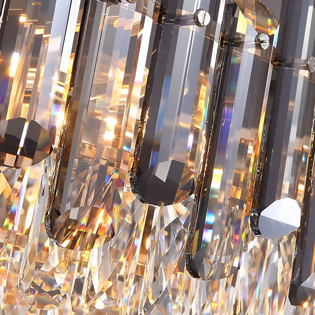 Round drum crystal chandelier with a gold frame, adding opulence to a modern dining room.