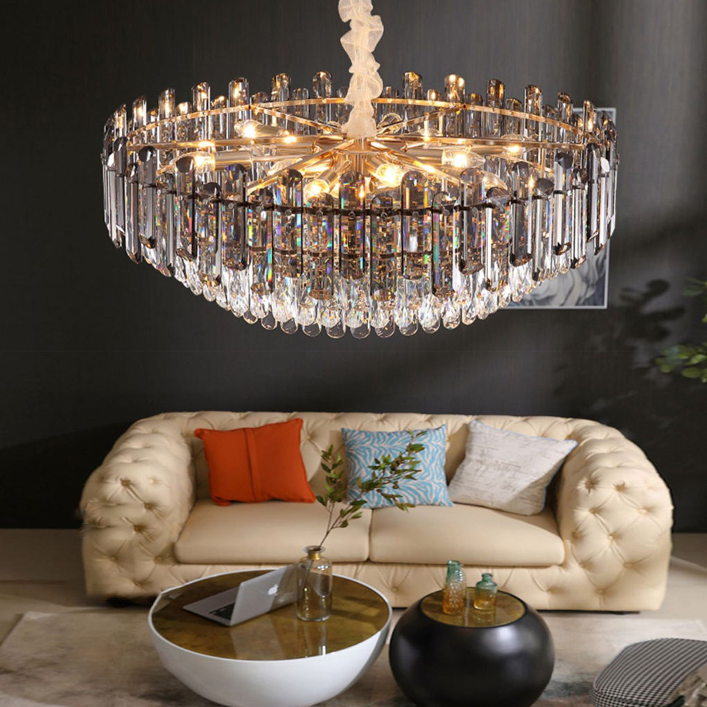 Round drum crystal chandelier with intricate crystal details, displayed against a dark background.