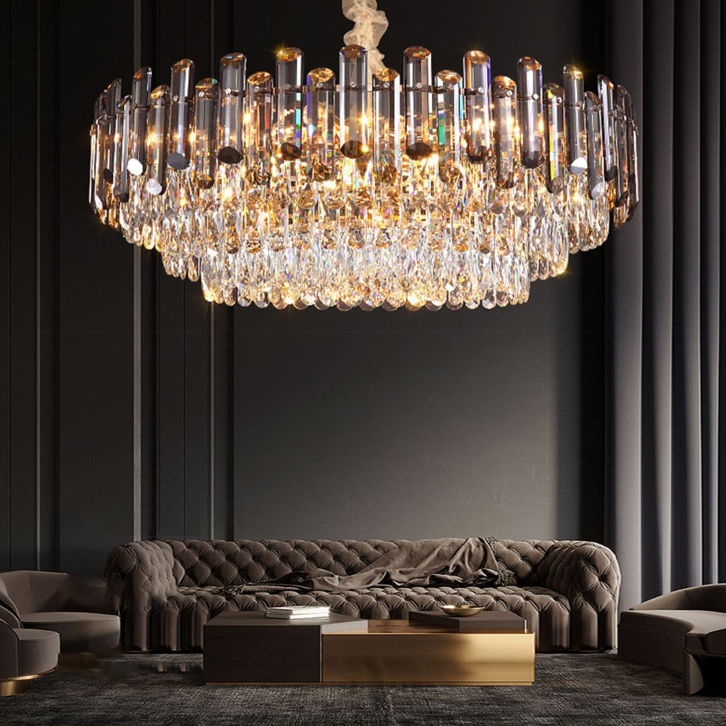 Round drum crystal chandelier hanging above a sofa, enhancing the elegance of a stylish living space.