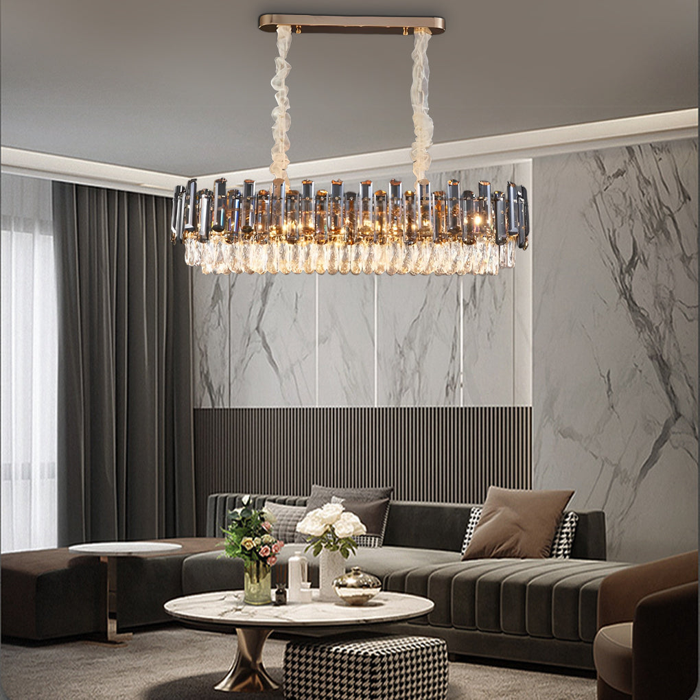 Round drum crystal chandelier casting a warm glow over a cozy seating area in a modern home.