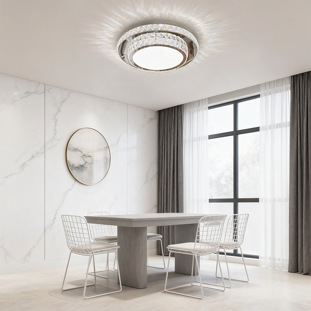 Round flush mount crystal light fixture adding elegance to a stylish dining area.