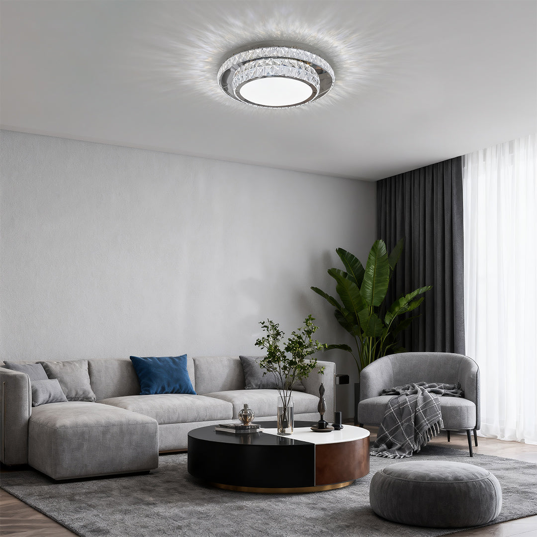 Round flush mount crystal light fixture shining softly in a contemporary living area.