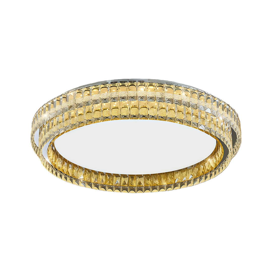 Round flush mount modern light with gold trim and elegant glass shade emitting warm light.