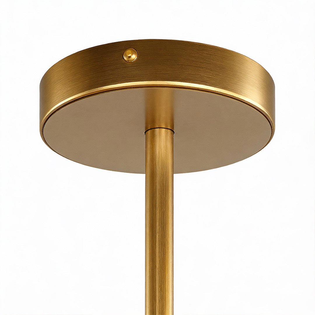 Ceiling mount of a round glass chandelier featuring a sleek gold finish and minimalist circular design.