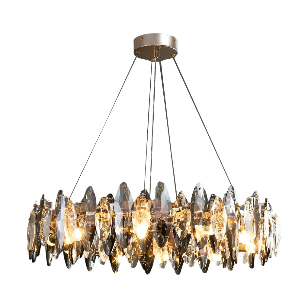 Round chandelier with crystals featuring a gold frame and staggered leaf-shaped pendants.