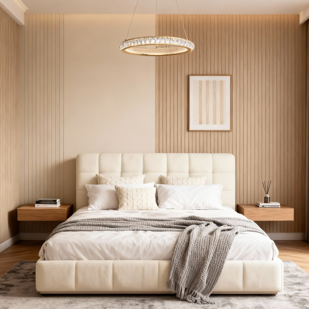 Round gold crystal chandelier providing ambient lighting in elegant bedroom with tufted headboard and neutral palette