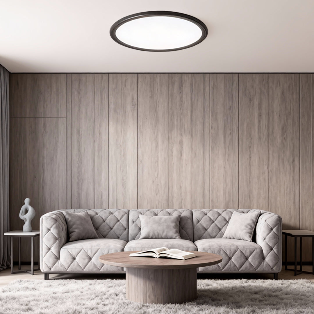 Modern round LED ceiling light installed in a contemporary living room