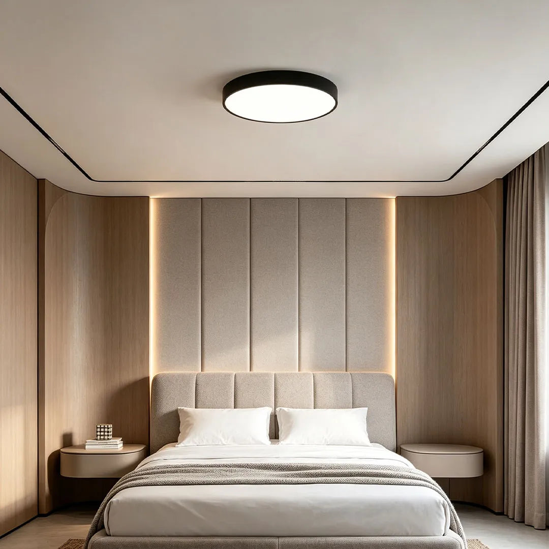 Round LED ceiling lights mounted in a modern bedroom with wood wall panels and warm vertical accent lighting.