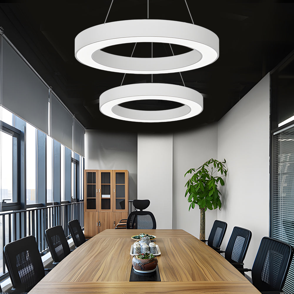 Round LED ring lights installed in an office meeting room