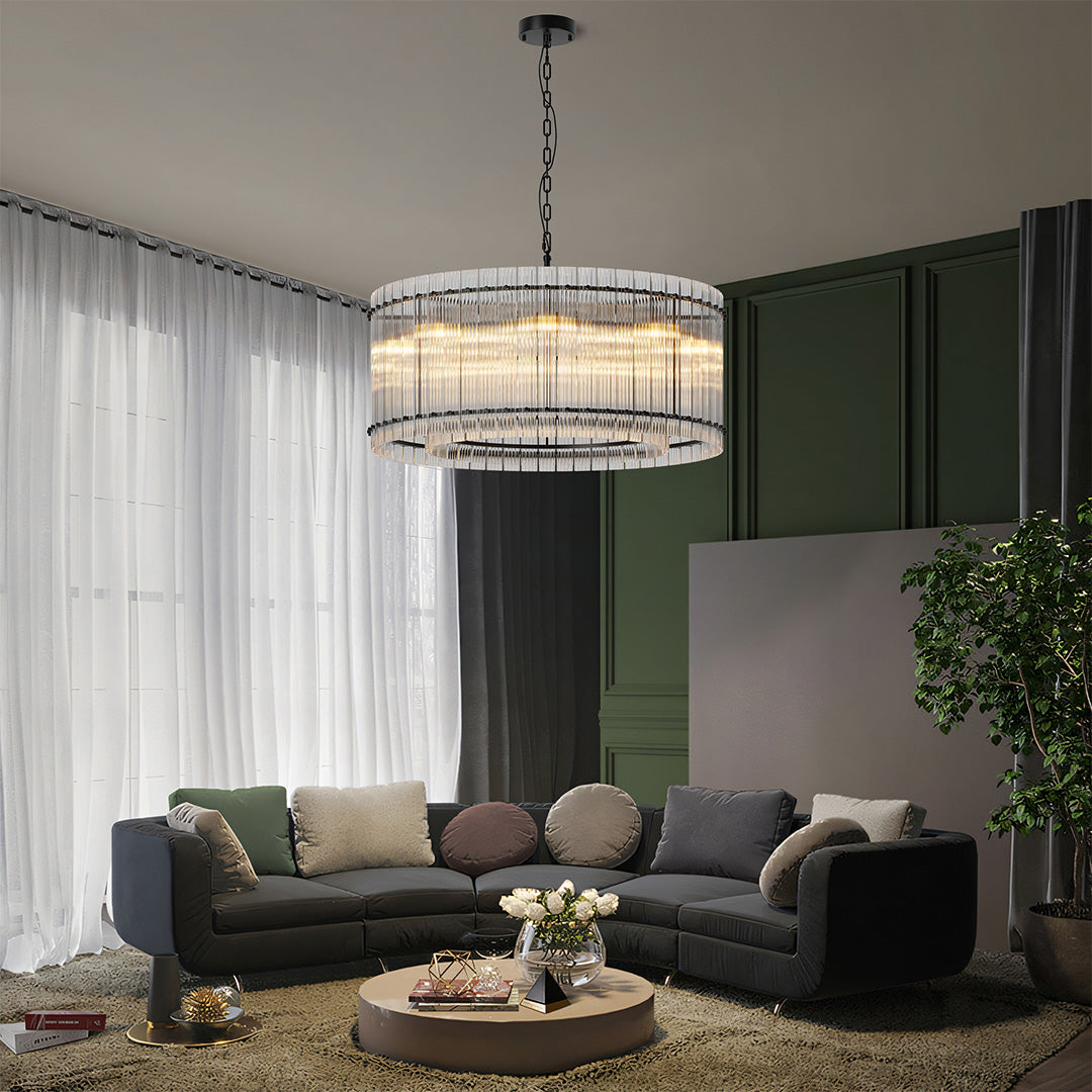 Round glass lamp shade chandelier illuminating a contemporary living space with soft warm light.