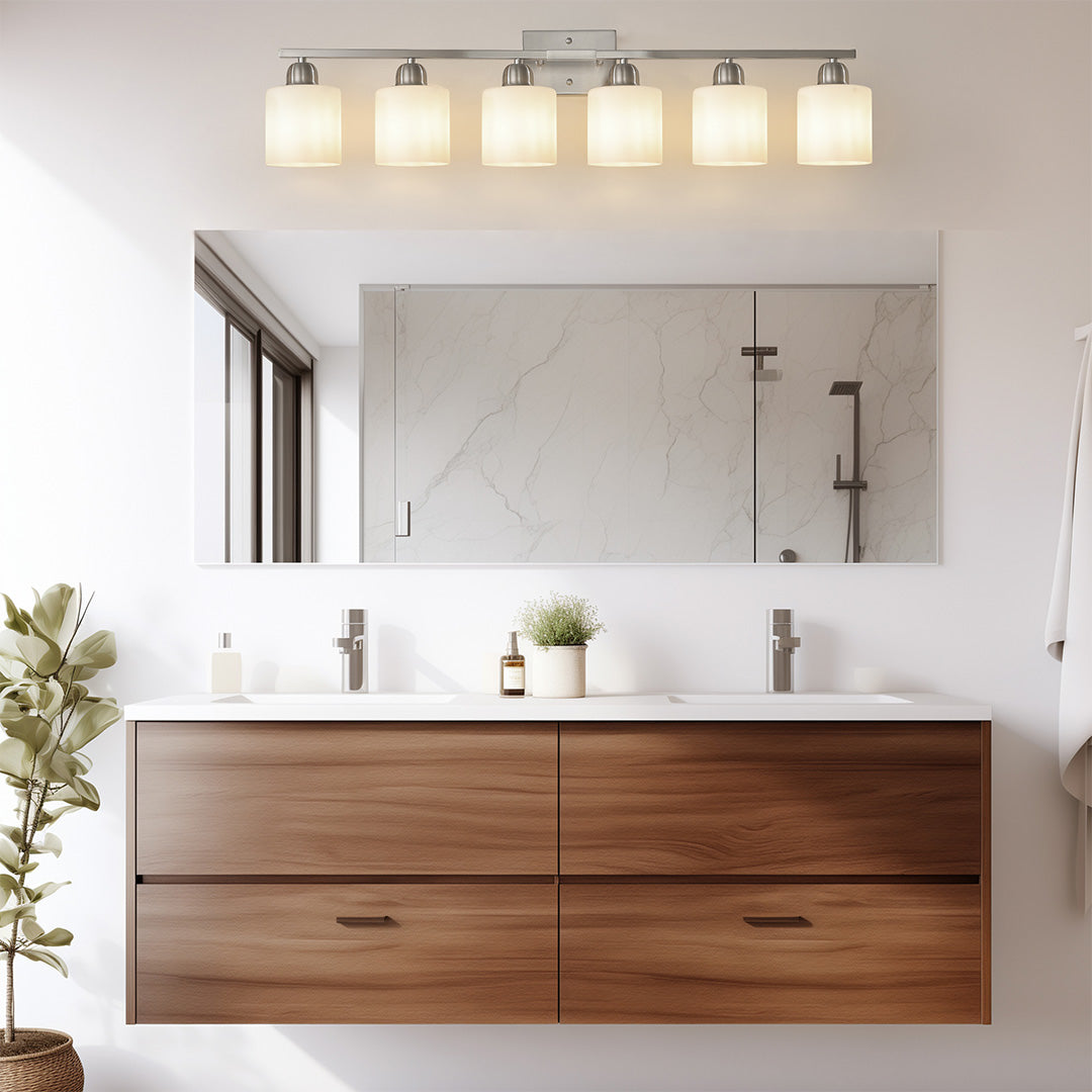 Modern bathroom vanity light with round mirrors and gold accents, creating a luxurious and stylish look.