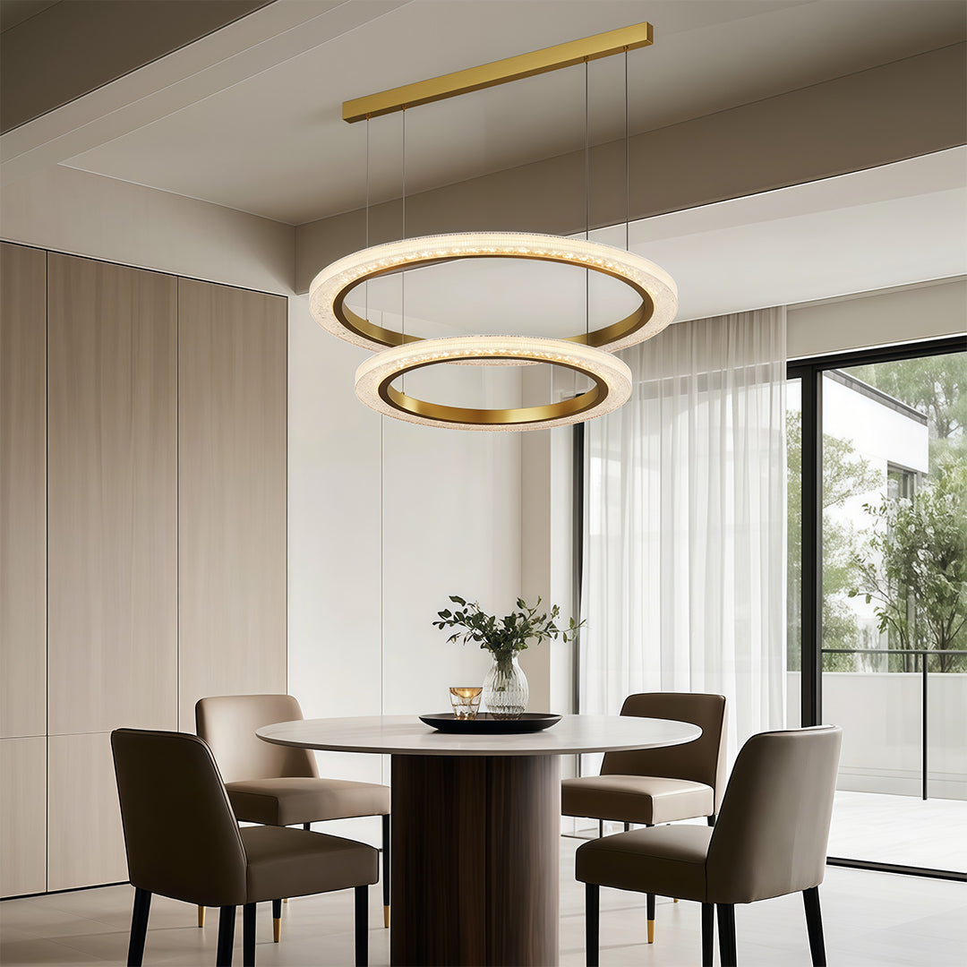 Round modern chandelier illuminating contemporary dining room with wood paneling and designer furniture
