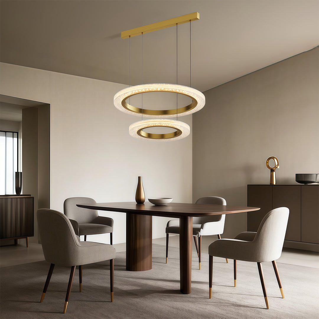 Modern luxury chandeliers creating warm ambiance in contemporary dining area with neutral tones
