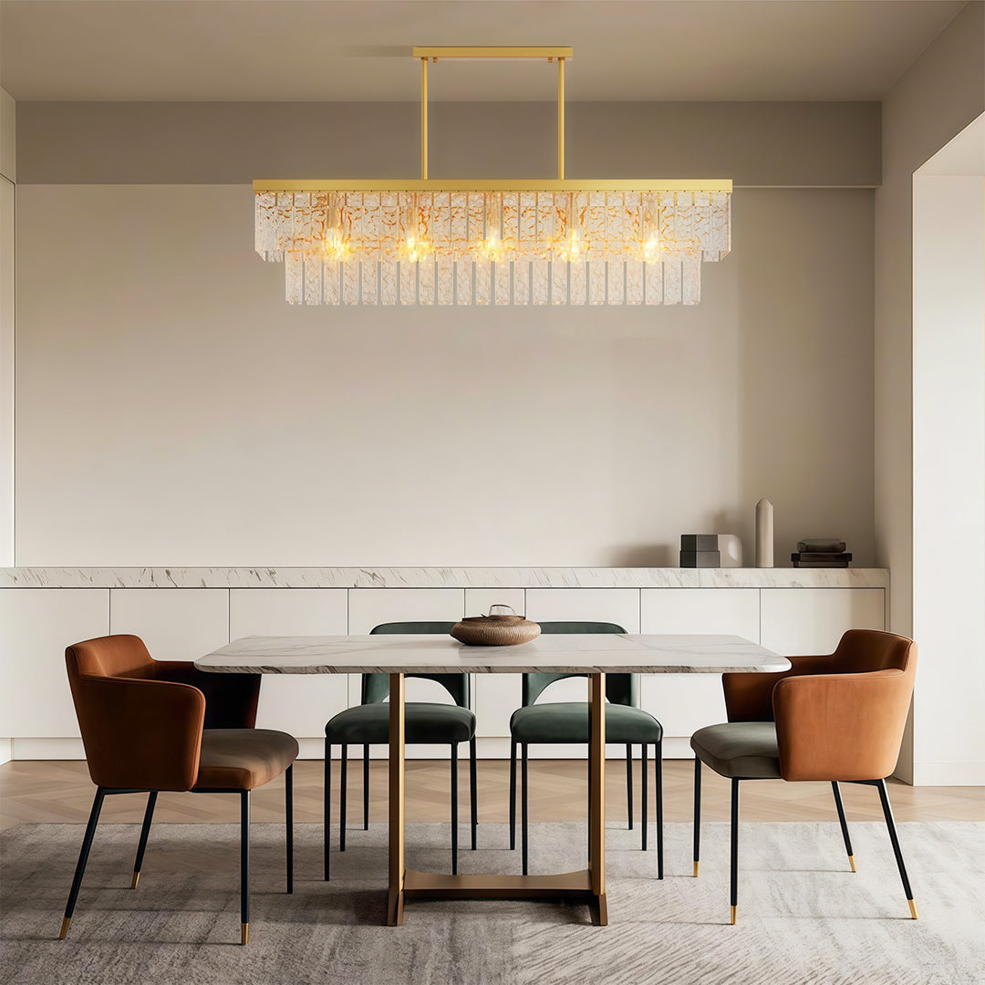 Luxury modern forms chandelier style round modern chandelier above modern dining with rust-colored chairs.