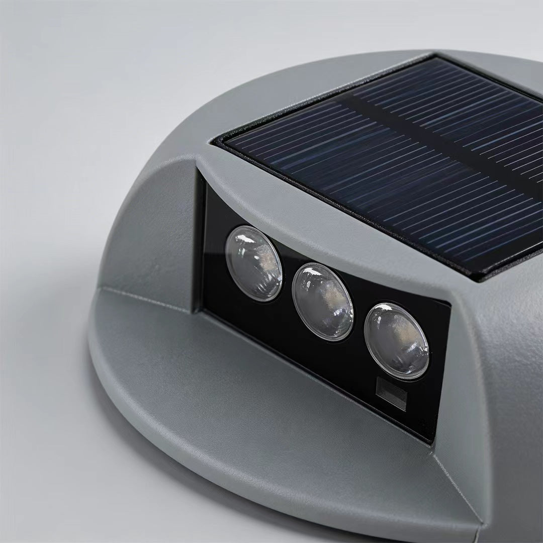 Round outdoor deck light enhancing a stylish patio with soft illumination.