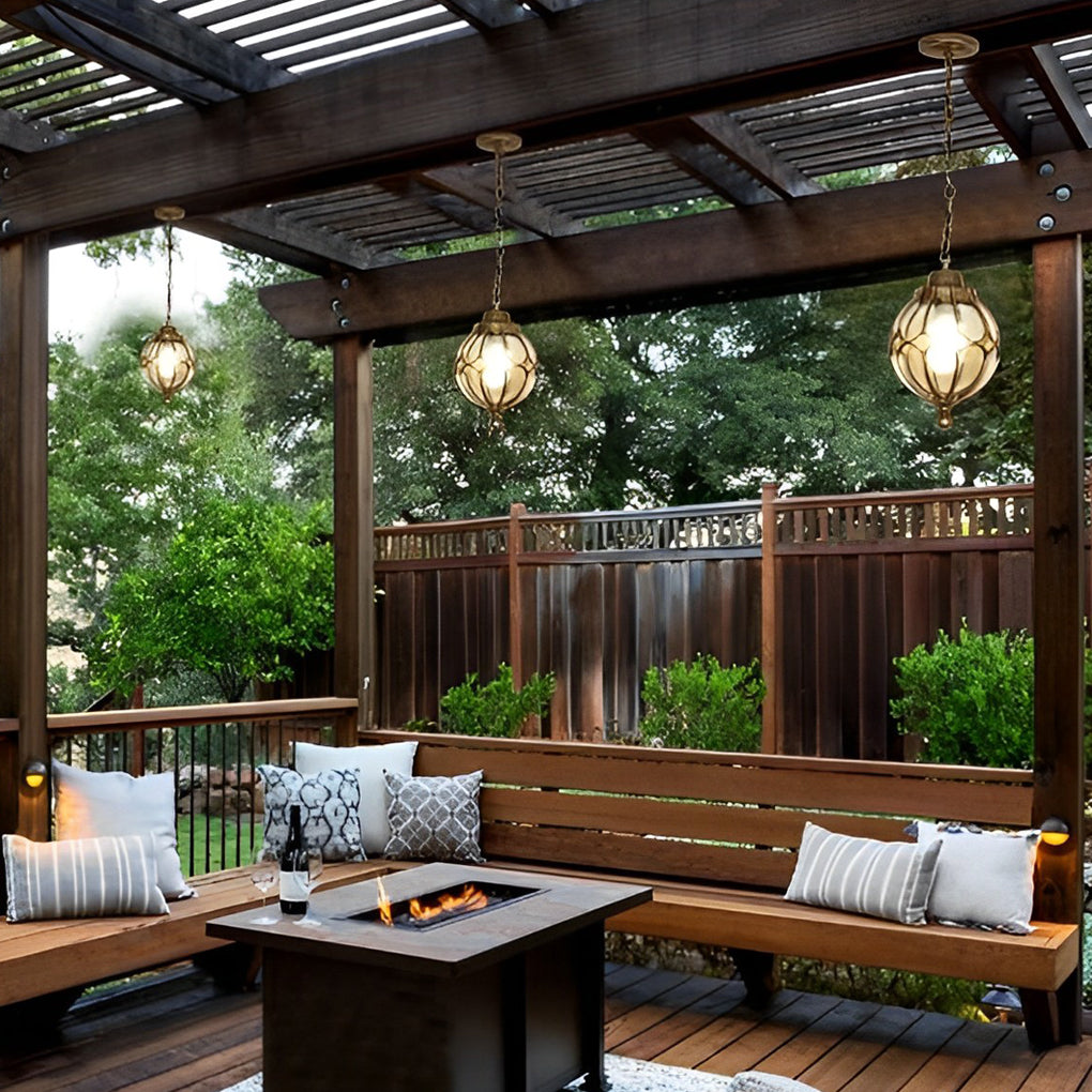 Round outdoor hanging lights with a bronze finish, providing elegant lighting.