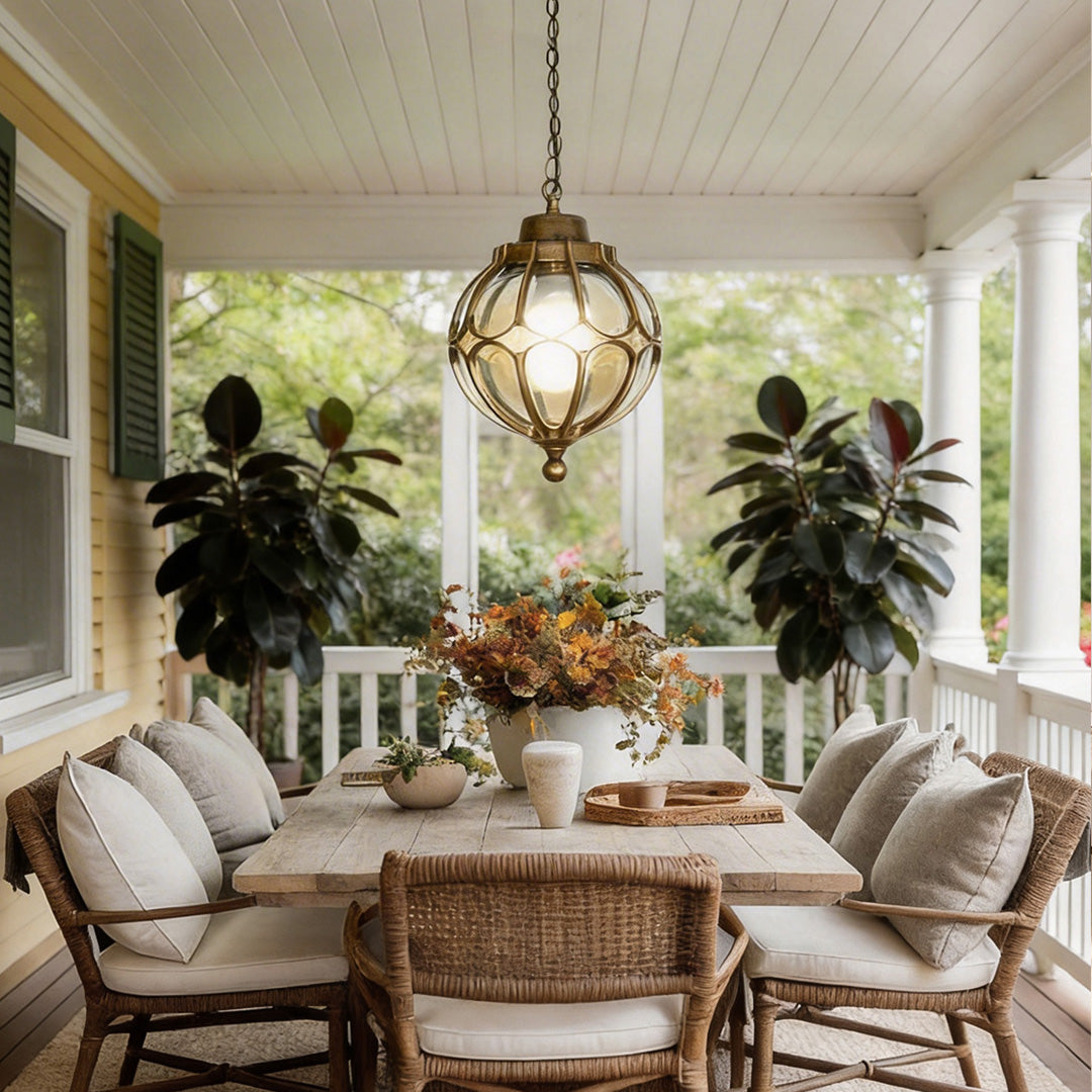 Round outdoor hanging lights illuminating a cozy porch with warm, inviting glow.