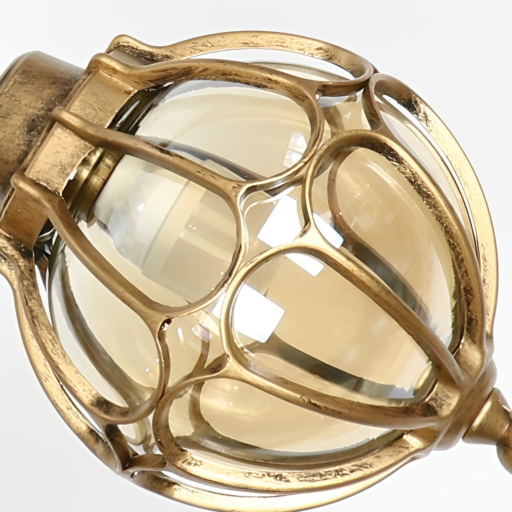 Round outdoor hanging lights with a close-up of their warm light and glass panels.