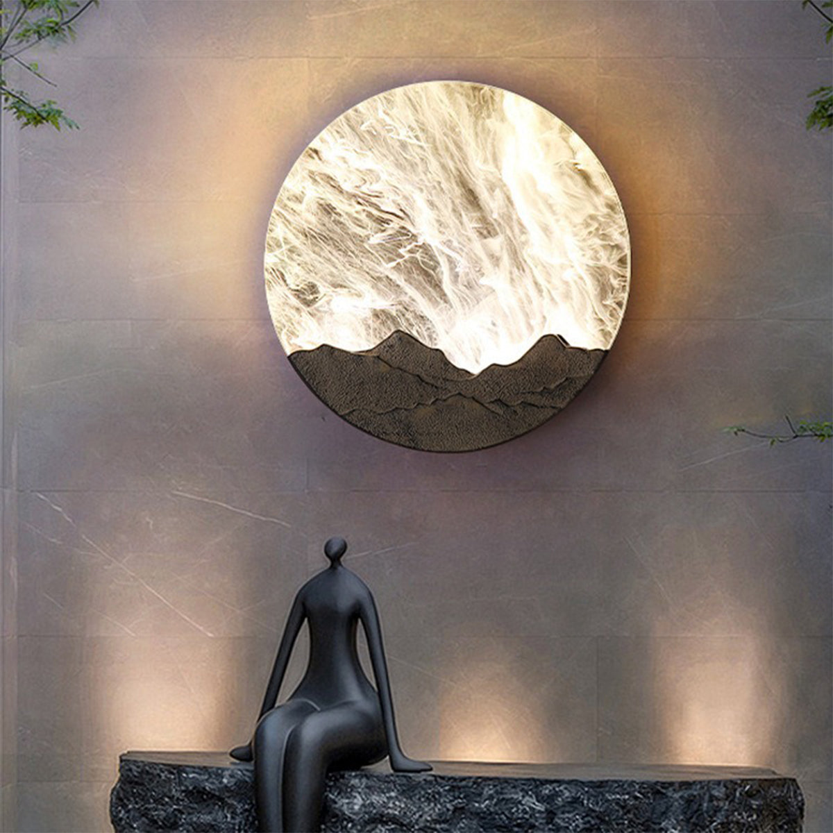 Round outdoor sconce with a close-up view of its textured, wave-like design.